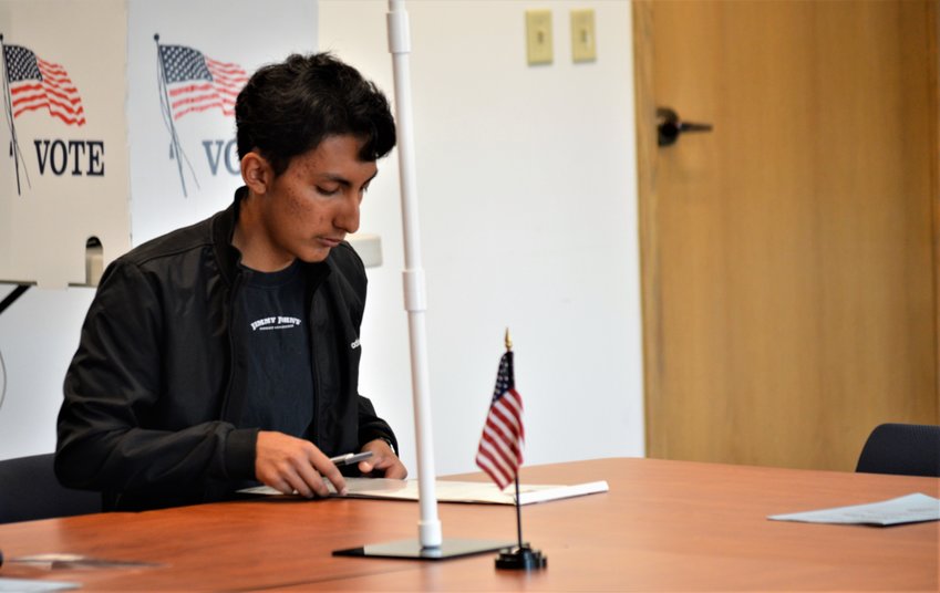 Gabriel Cervants of Thornton fills out his ballot paperwork Nov. 5 at Adams County's 122nd and Pecos voter service center. His brother Steven Cervantes was on the ballot, seeking the Thornton mayor's job.